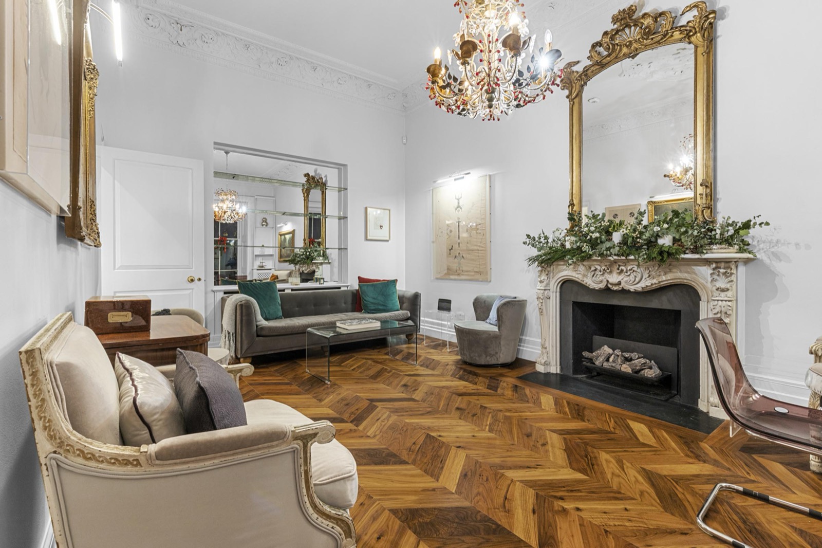 Drawing room photography in a Belgravia townhouse: gilt mirror, marble fireplace and herringbone parquet